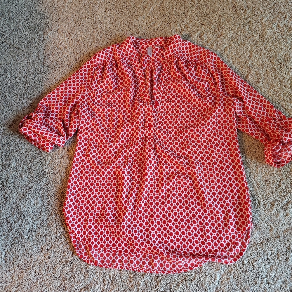 Tacera red and white dot shirt.